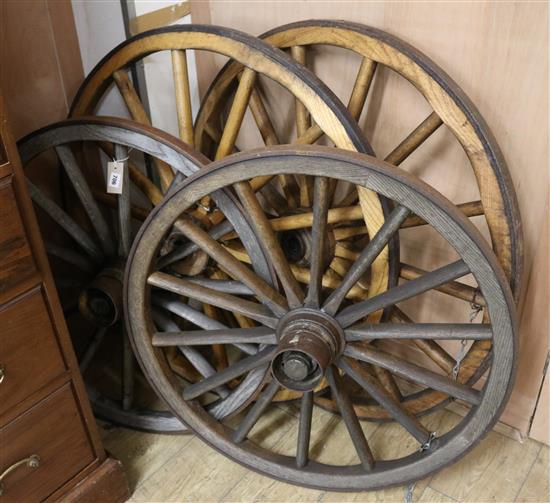 A set of four Victorian metal rimmed wagon wheels